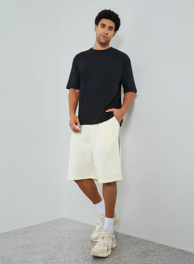 Styli Men Off-White Striped Terry Oversized Shorts